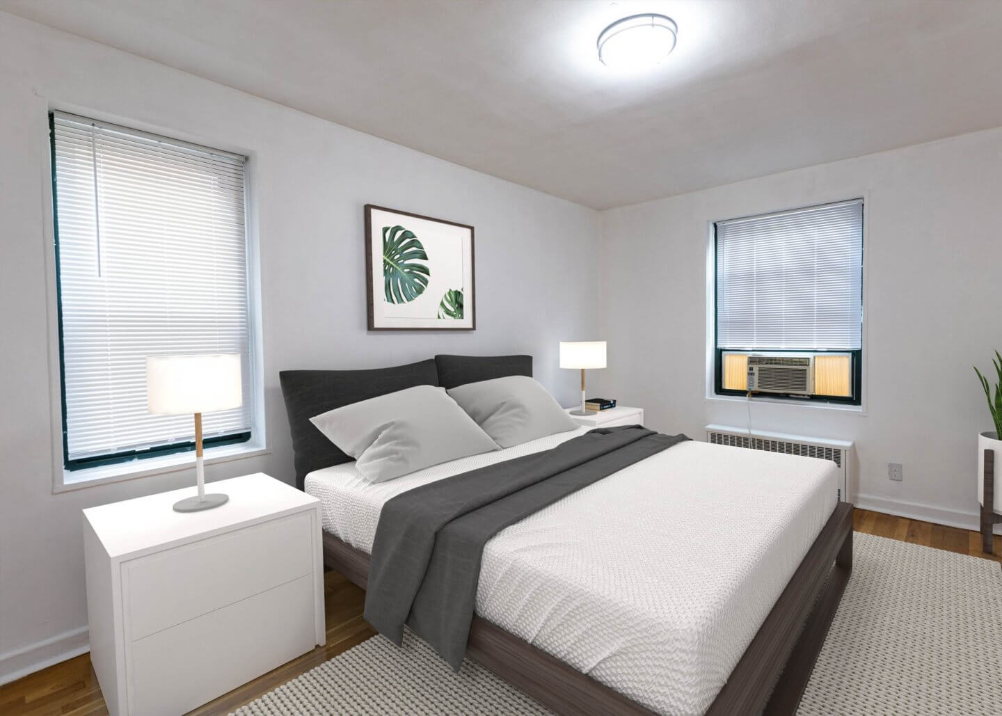 hoyt bedford mdoern bedroom with bed and side table lamp window